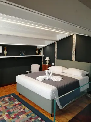 a bedroom with a large bed in a room at Casa da Giannina in Palermo