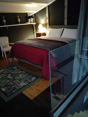 a bedroom with a bed and a glass table at Casa da Giannina in Palermo