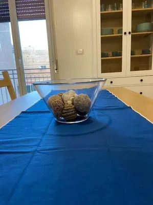 a bowl on a table with a blue table cloth at Casa Peppino in Palermo