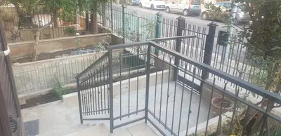 an iron railing on a balcony with a street at Casa vacanze Il Girasole in Bagheria