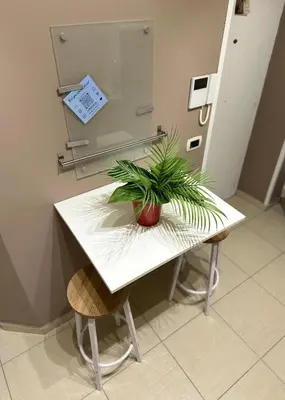 a table with a plant sitting on top of it at A Casuzza di Gio in Palermo