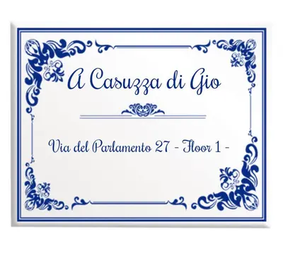 a wedding invitation card in blue and white at A Casuzza di Gio in Palermo