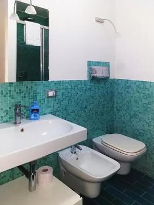 a bathroom with a sink and a toilet at Appartamento Salinas Palermo in Palermo