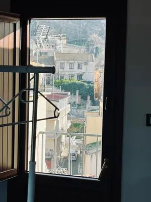 a view of a city from a window at Corleone Home in Corleone