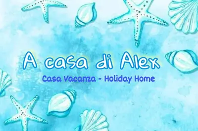 a sign for a cafe at aichen with stars and shells at A casa di Alex in Palermo