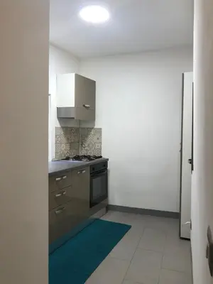 a kitchen with a sink and a stove at City Center Apartment da FeLù in Palermo
