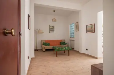 a living room with a couch and a table at Casa Ferrito - Porticello in Porticello