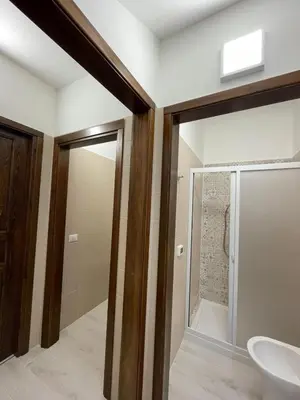 a bathroom with a glass shower and a sink at Civico 356 in Castellammare del Golfo