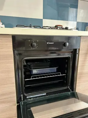 an oven with its door open in a kitchen at A casa ru zu Nino in Capaci
