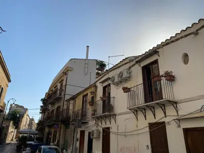 a group of buildings with balconies on a street at DEMMA LUXURY HOME in Palermo