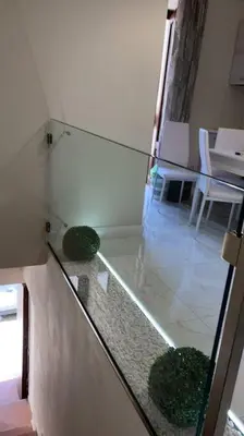 a glass counter with two plants in a room at DEMMA LUXURY HOME in Palermo
