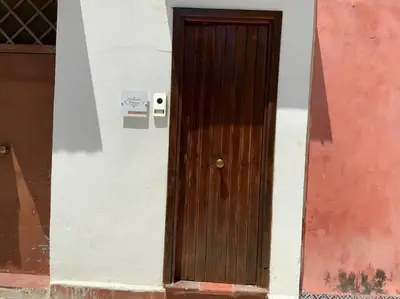 a wooden door on the side of a building at Demma' s DIAMOND in Palermo