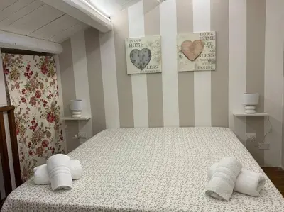 a bedroom with a bed with two towels on it at Demma' s DIAMOND in Palermo