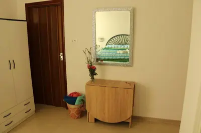 a room with a mirror and a dresser and a bed at Pensiero Speciale in Alcamo
