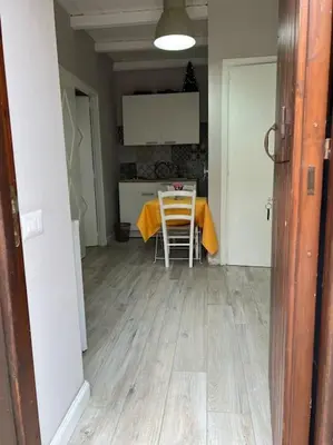 a kitchen with a table and chairs in a room at Spasimo Boutique in Palermo