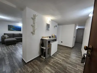 a living room with a couch and a table at Don Vito's Home, DsG2 Short Lets, 250 mt Metrò in Palermo