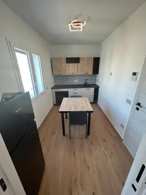 a kitchen with a table in the middle of a room at La Nicaredda in Alcamo