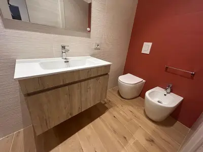 a bathroom with a sink and a toilet at La Nicaredda in Alcamo