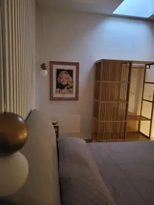 a bedroom with a bed with towels on it at Malaspina Cico Suite in Palermo