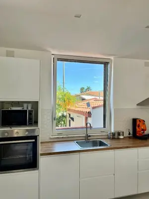 a kitchen with a sink and a window at Villa Capri Holiday Home in Campofelice di Roccella
