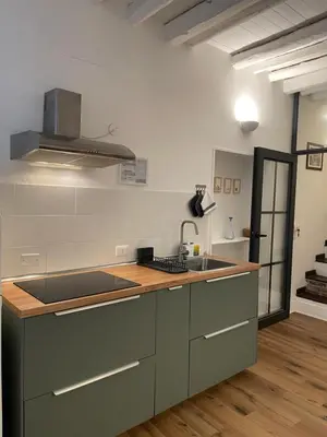 a kitchen with a sink and a counter top at Il corvo e la volpe in Palermo