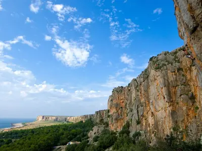 a view of a mountain with the ocean in the background at Holiday Home Acquamarina Gaia by Interhome in San Vito lo Capo