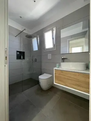 a bathroom with a toilet and a sink and a shower at Summer Vibes in Castellammare del Golfo