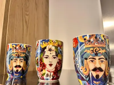 two colorful vases sitting on top of a table at Nigra Apartments in Palermo