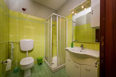 a bathroom with a toilet and a sink and a shower at Villa Oasi del Relax Flavianna in Castellammare del Golfo