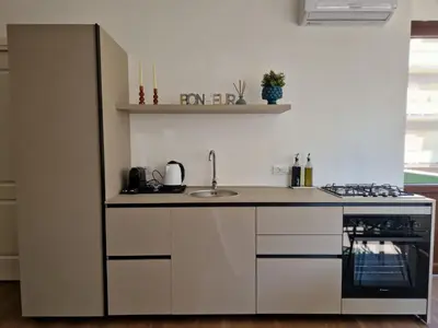 a kitchen with a sink and a counter top at SPRING APARTMENTS in Palermo