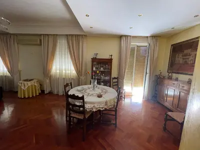 a dining room with a table and chairs at Casa Michela in Palermo