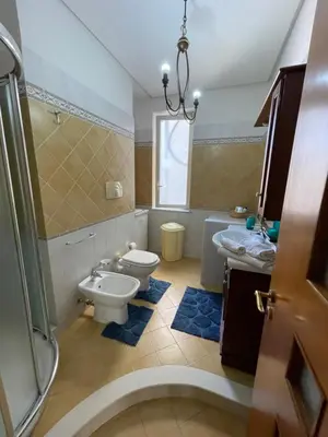 a bathroom with a toilet and a sink and a shower at Casa Michela in Palermo