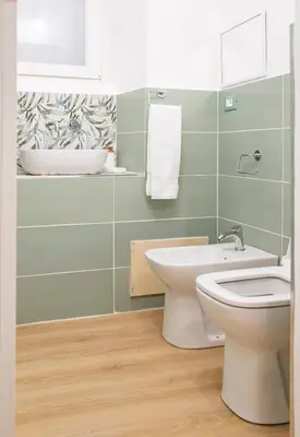 a bathroom with a toilet and a sink at Pilly House Rinascente in Palermo