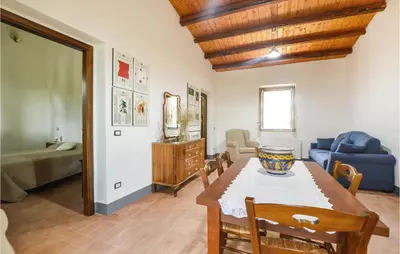 a living room with a table and a couch at Casa San Giovanni in Giuliana