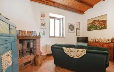 a living room with a couch and a fireplace at Casa San Giovanni in Giuliana