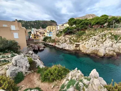 a view of a river in a town with buildings at Casa di Leda 2 in Santa Flavia