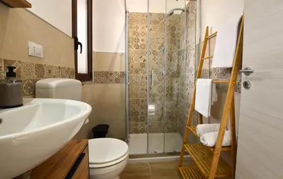 a bathroom with a shower and a toilet and a sink at Lovely Apartment In Trappeto With Wifi in Trappeto