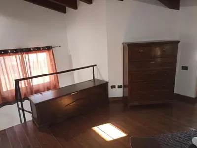 a room with a staircase and a dresser and a bedroom at A&C GOLD DIAMOND in Palermo