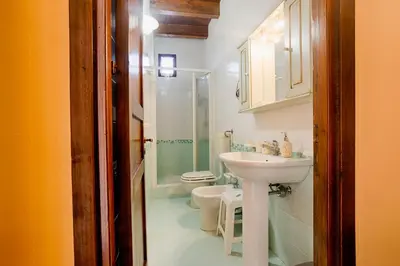 a bathroom with a sink and a toilet at GuestHost - Corso Garibaldi - Castellammare Central Flats in Castellammare del Golfo