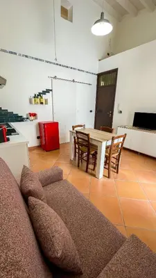 a living room with a couch and a table at Le Case di Romeo in Palermo