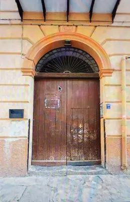 a large wooden door on the side of a building at Star Politeama apartment, in centro città. in Palermo