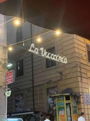 a sign for a restaurant in front of a building at Appartamento NA ME CASA in Palermo