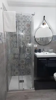 a bathroom with a shower and a sink at Loft Pozzillo in Monreale