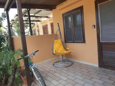 a bike parked in front of a house at Ca San Vito Lo Capo Villa Maria in San Vito lo Capo