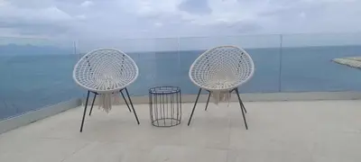 two white chairs sitting on top of a building at La Villa di Nonna Pina in Balestrate