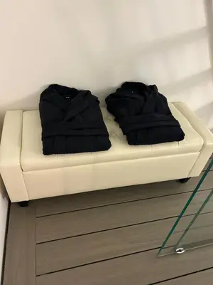 two black pillows on a white couch in a room at MARGOT HOUSE PALERMO in Palermo
