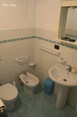 a bathroom with a toilet and a sink at Baglio 