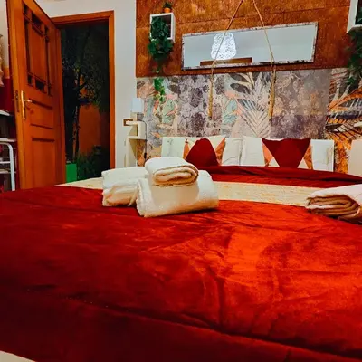 a bedroom with a large bed with towels on it at Regina Elena in Cinisi