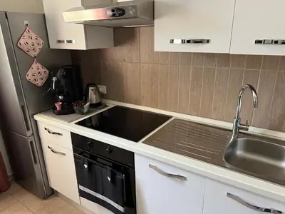 a stove with pots and pans on top of it at Via Serradifalco, Zona Via Dante in Palermo
