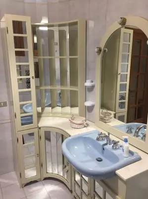 a bathroom with a sink and a mirror at Sicilian Apartment in Termini Imerese
